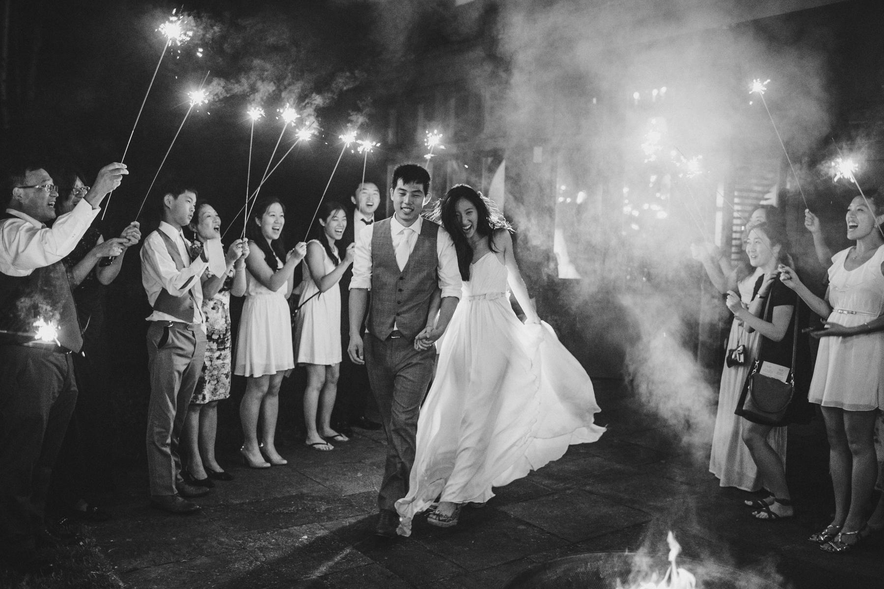 Bride and Groom celebrating with a sparkler exit.